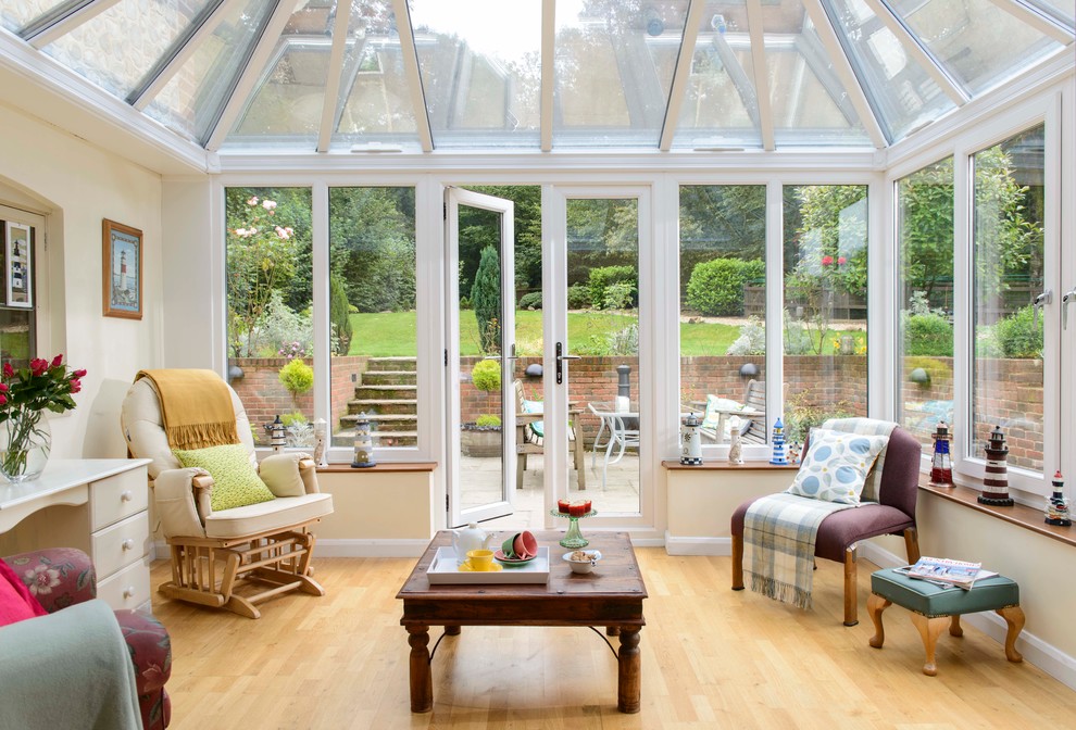 Inspiration for a contemporary conservatory in Hampshire with laminate floors.