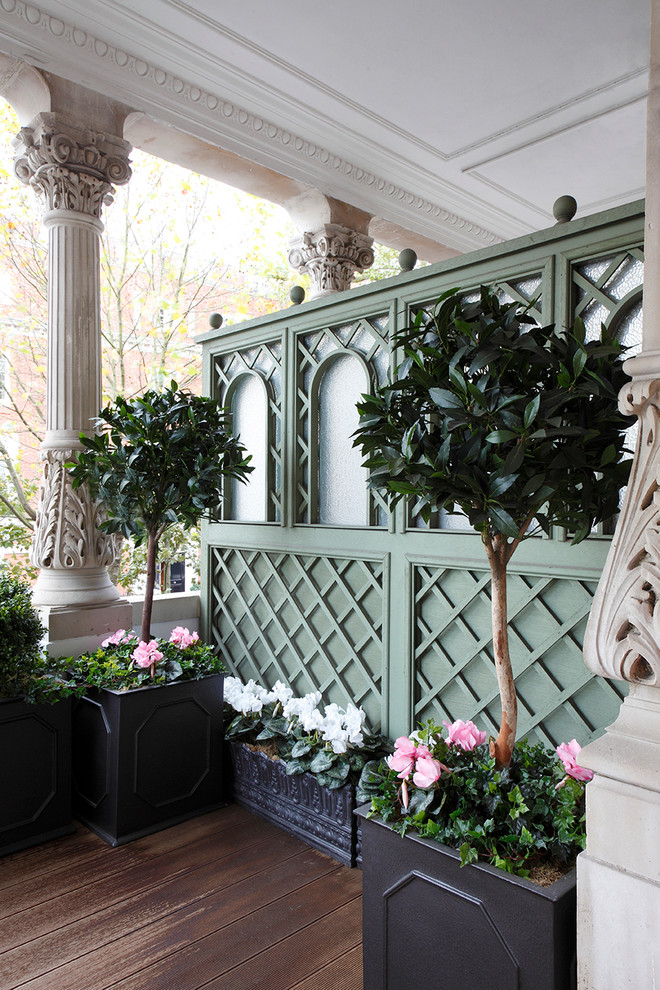 Inspiration for a traditional veranda in London with decking.