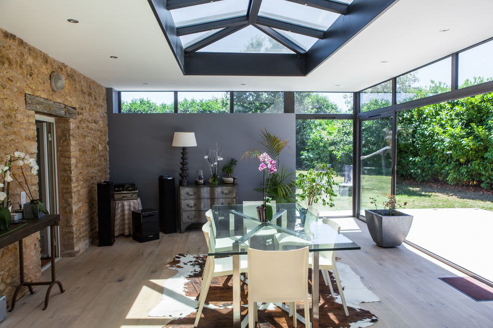 This is an example of a traditional conservatory in Other with a glass ceiling.