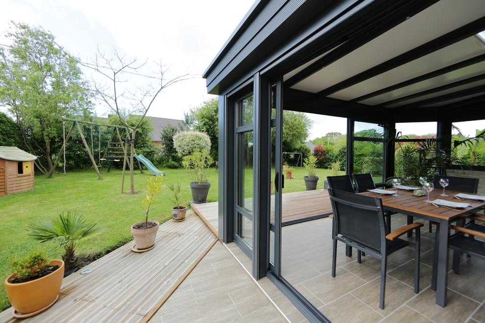 Design ideas for a contemporary conservatory in Other with ceramic flooring and a standard ceiling.