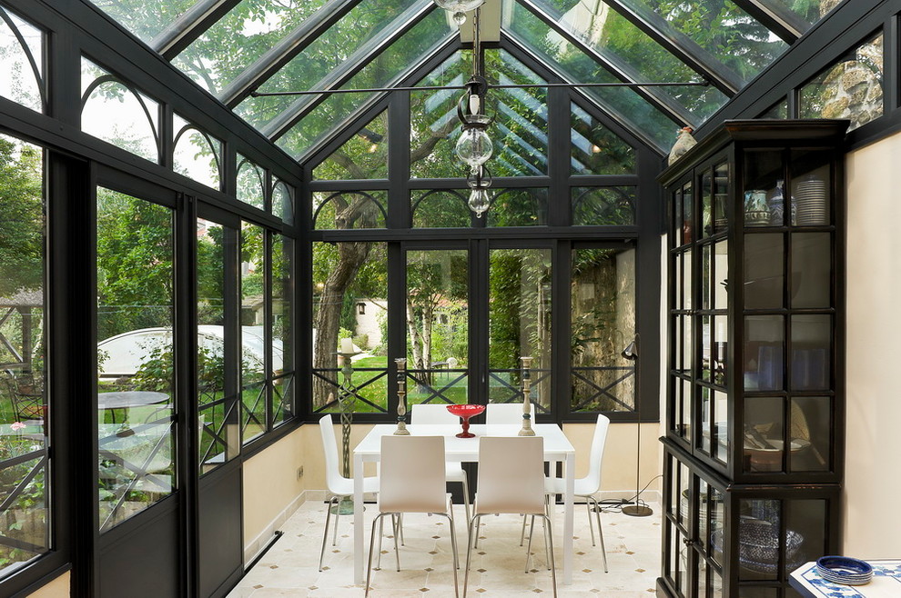 Inspiration for a medium sized victorian conservatory in Dijon with no fireplace and a glass ceiling.