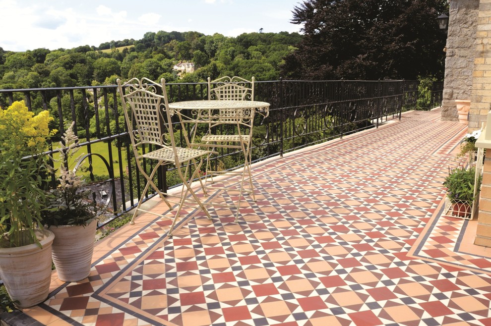 Large victorian back veranda in Cheshire with tiled flooring.