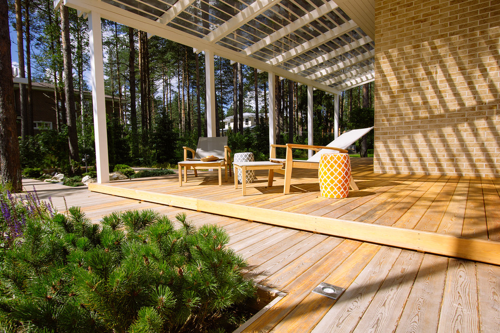 This is an example of a small transitional porch design in Saint Petersburg with decking.