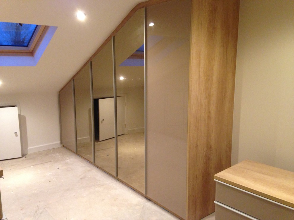 Example of a trendy closet design in West Midlands