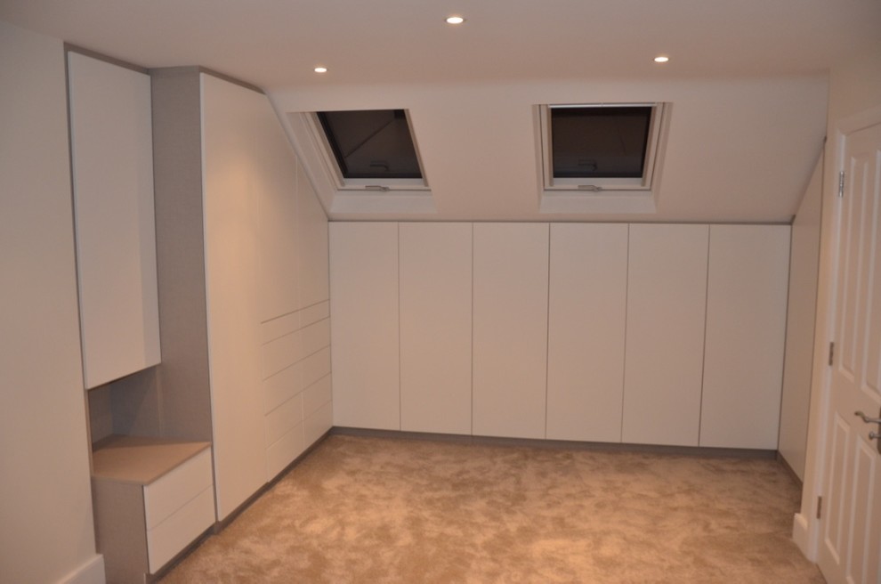 Attic room wardrobe storage with push to open doors, East