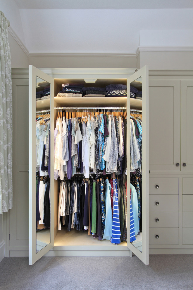 Closet - large traditional carpeted closet idea in Hampshire