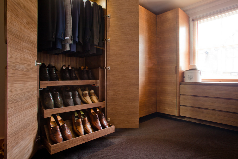 Example of a trendy closet design in Other
