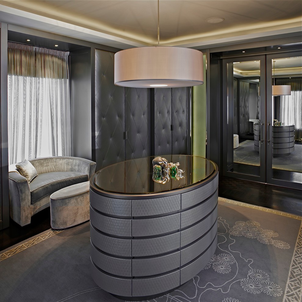Trendy women's dressing room photo in London with gray cabinets
