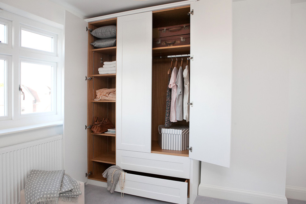 Inspiration for a carpeted closet remodel in Berkshire with shaker cabinets