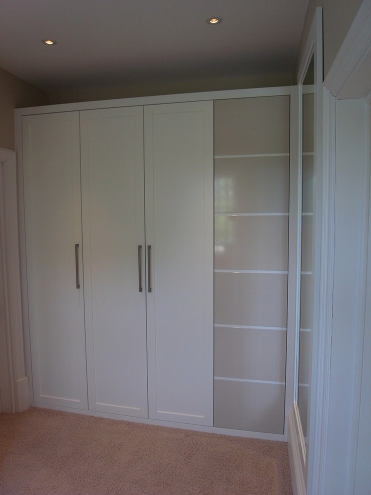 Example of a small trendy closet design in London