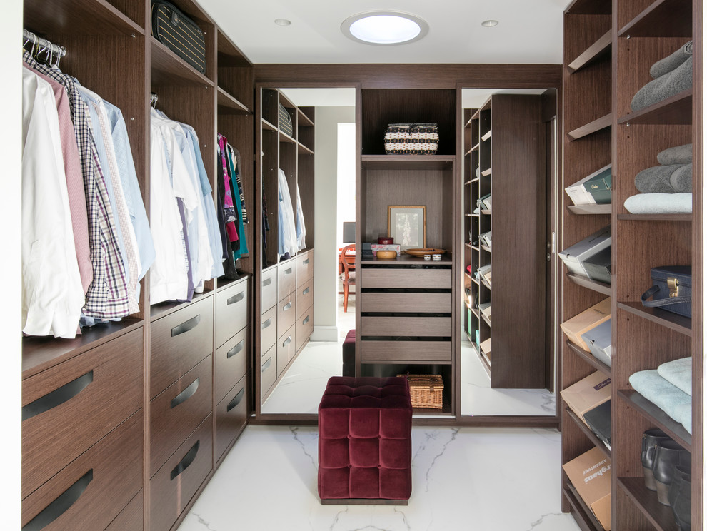 Inspiration for a contemporary dressing room in London with open cabinets, dark wood cabinets and white floors.