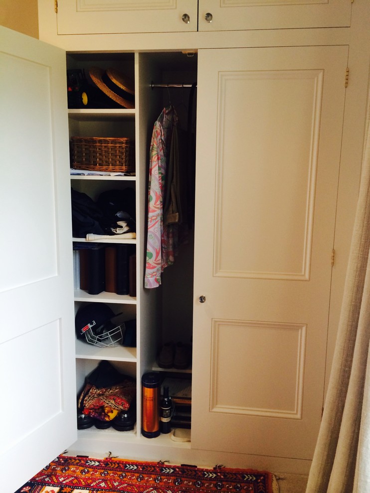 Inspiration for a mid-sized cottage closet remodel in London