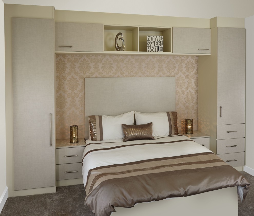 Photo of a modern gender neutral standard wardrobe in Hampshire with flat-panel cabinets and grey cabinets.