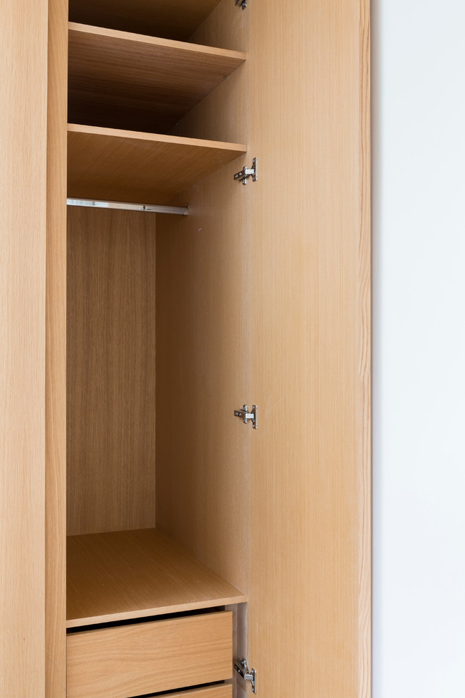 Inspiration for a small contemporary built-in wardrobe in London.