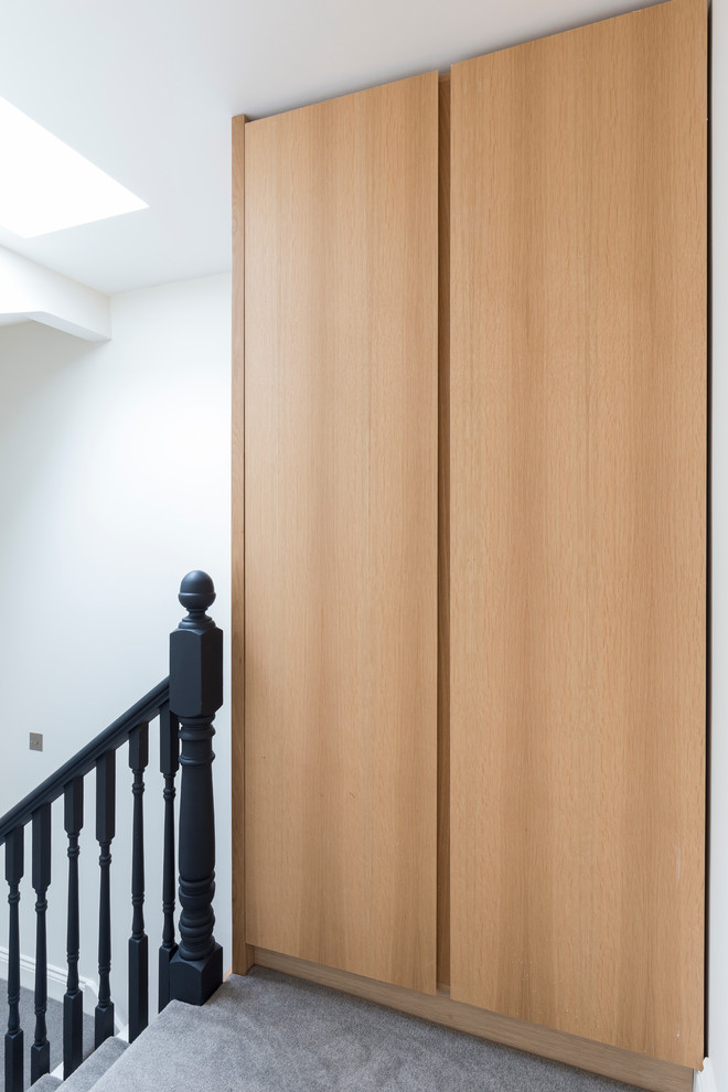 Photo of a small contemporary built-in wardrobe in London.