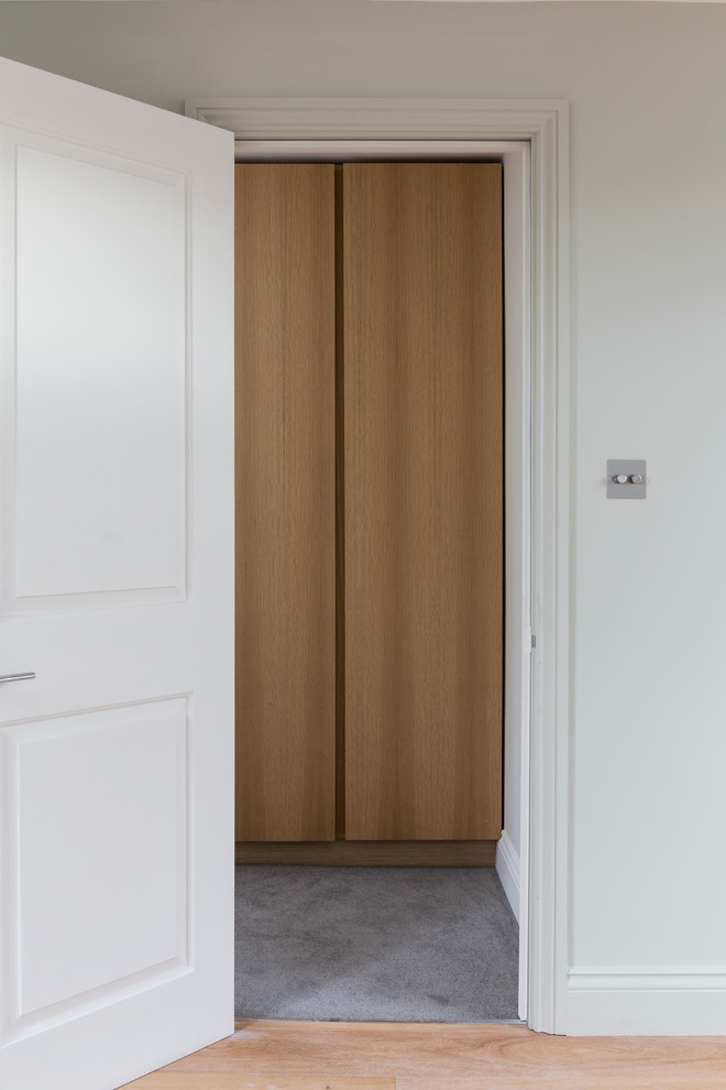 Photo of a small contemporary built-in wardrobe in London.