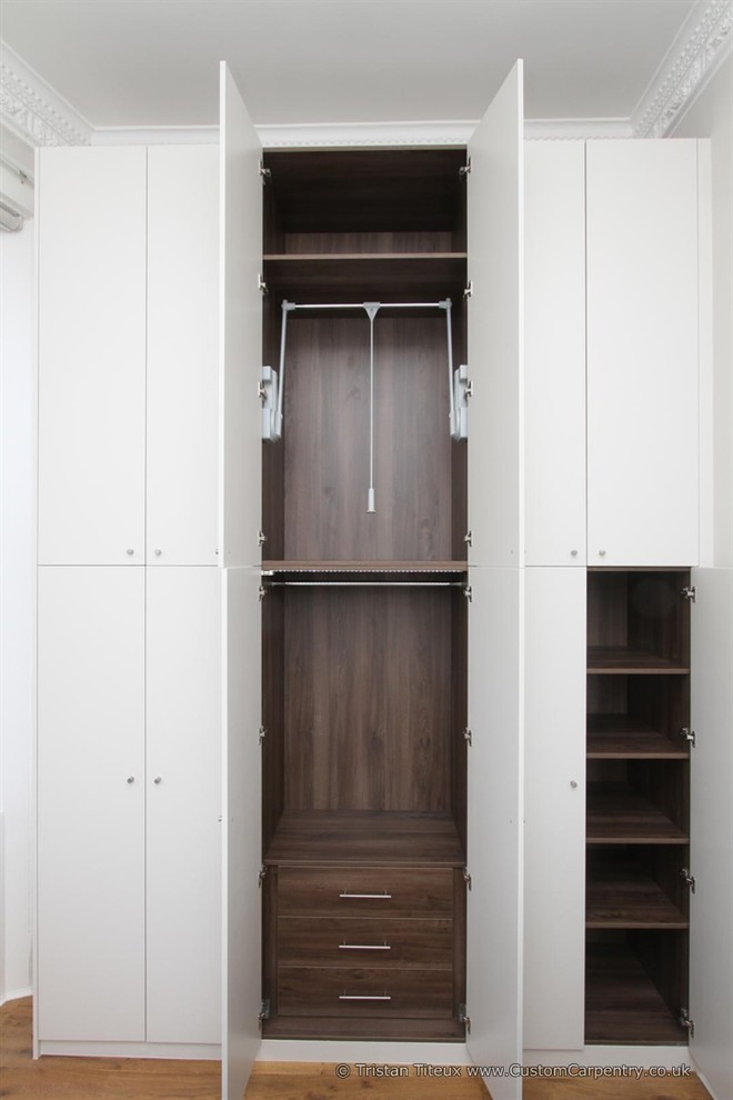 Example of a large trendy closet design in London