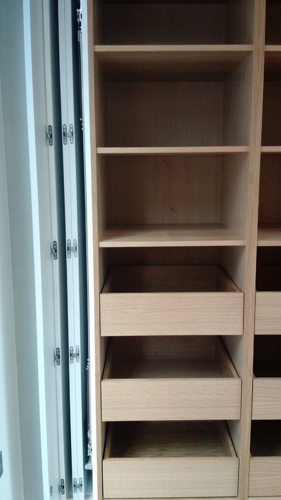 This is an example of a contemporary wardrobe in Wiltshire.