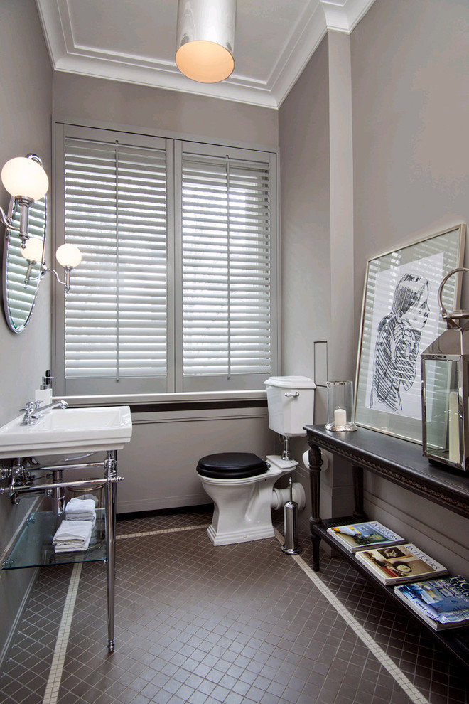 Mid-sized transitional mosaic tile floor powder room photo in Lille with a console sink, gray walls and a two-piece toilet