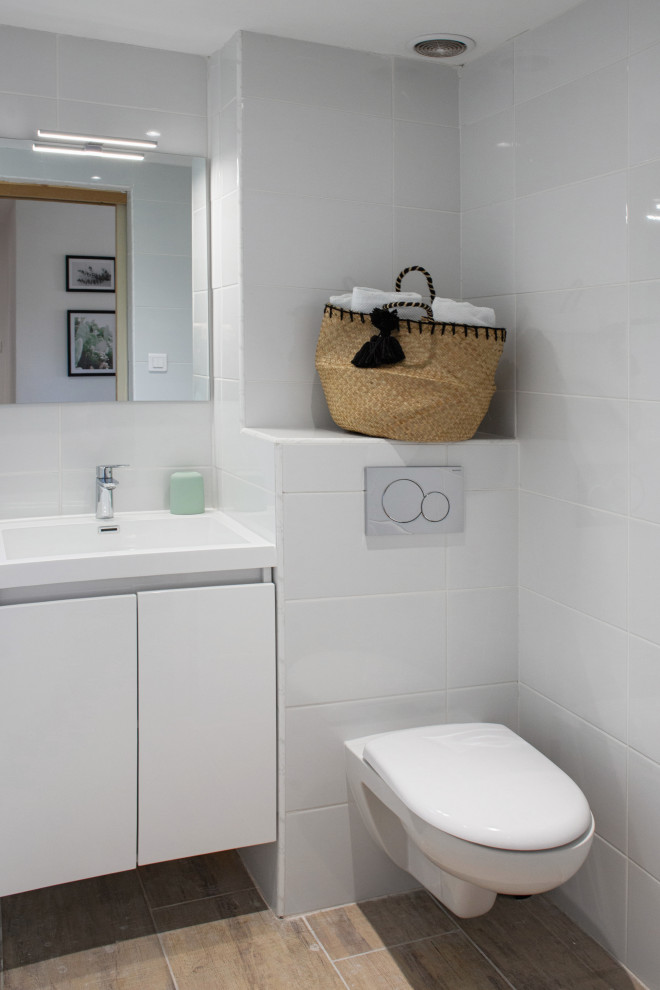 Inspiration for a contemporary powder room remodel in Other