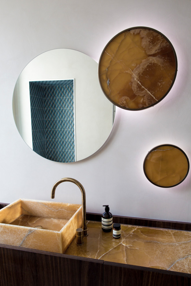 Photo of a contemporary cloakroom in Paris with white walls, a vessel sink and brown worktops.