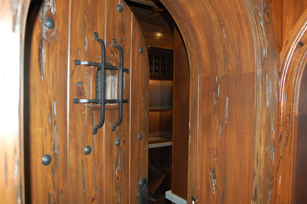 Photo of a large traditional wine cellar in Miami with storage racks.