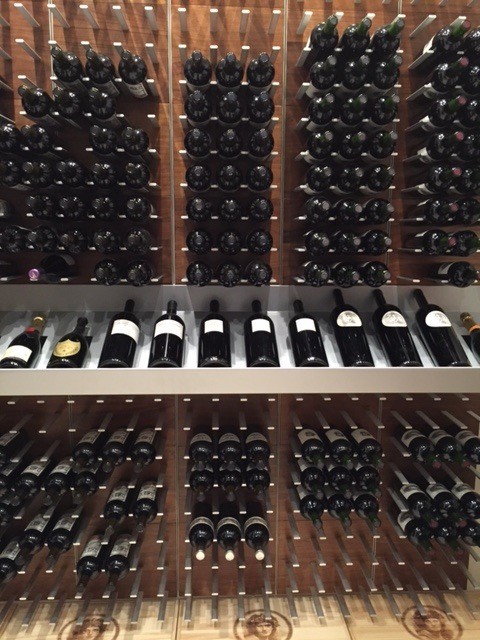 Photo of an expansive contemporary wine cellar in San Francisco with display racks.
