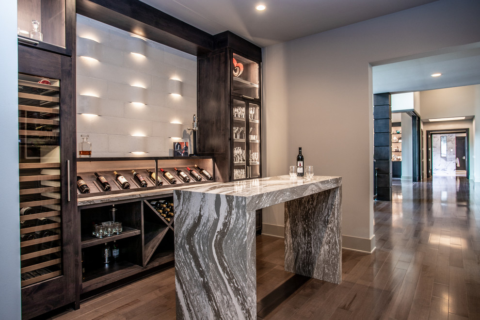Inspiration for a mid-sized contemporary dark wood floor and brown floor wine cellar remodel in Cleveland with diamond bins
