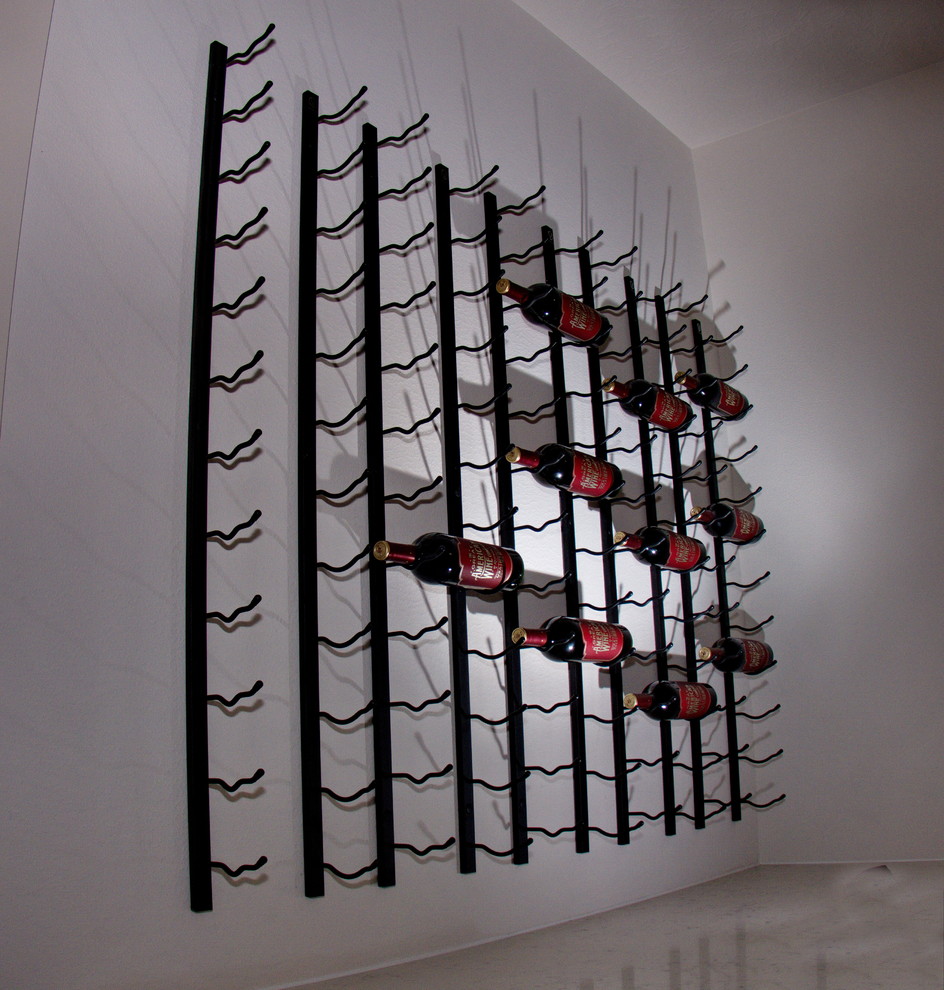 Small minimalist wine cellar photo in Houston with display racks