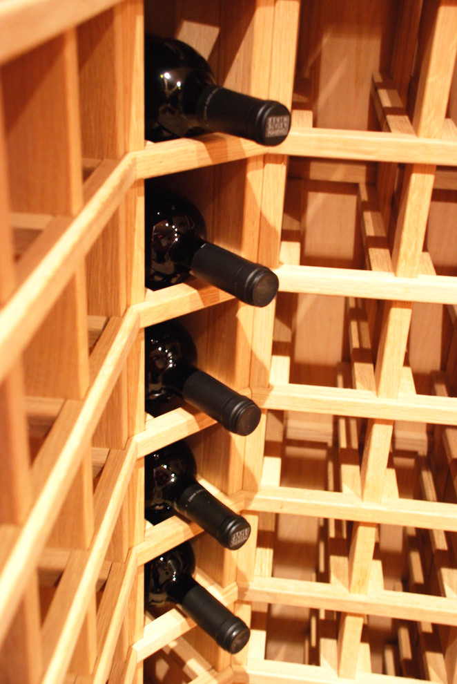 Photo of a medium sized classic wine cellar in Vancouver.