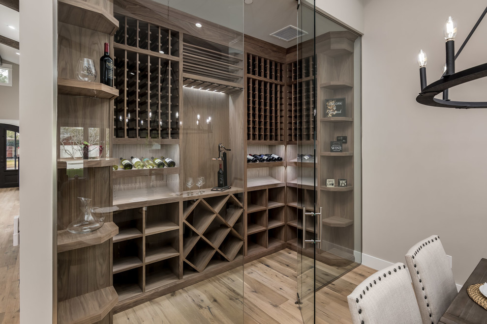 Classic wine cellar in Phoenix with medium hardwood flooring, storage racks and brown floors.