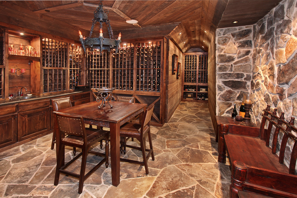 Inspiration for a large mediterranean wine cellar remodel in Orange County with storage racks