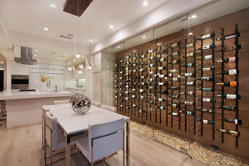 Trendy yellow floor wine cellar photo in Orange County with display racks