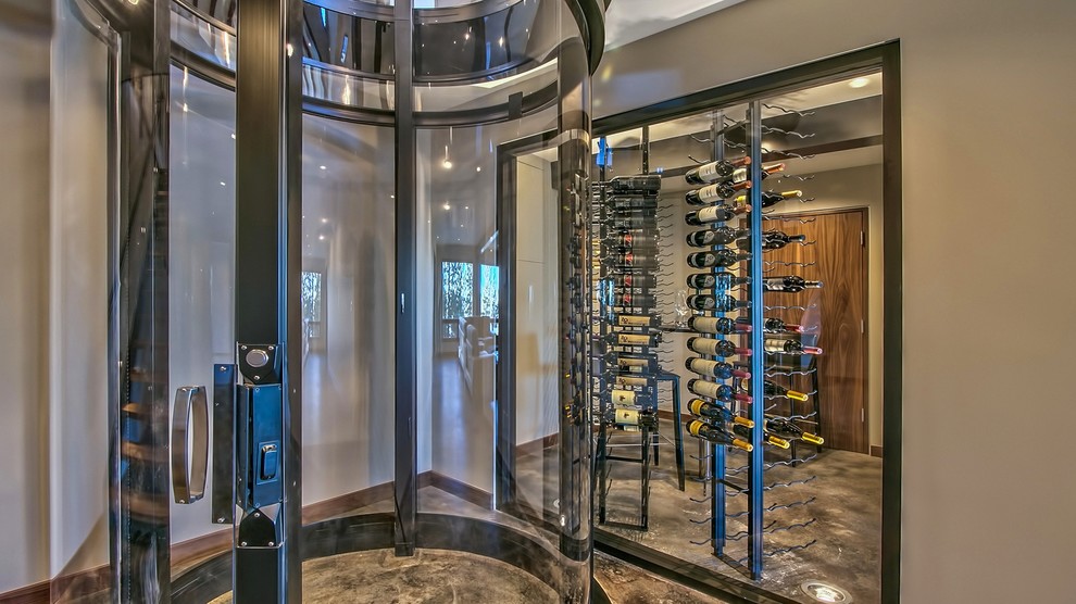 Example of a mid-sized trendy porcelain tile and brown floor wine cellar design in Other with display racks