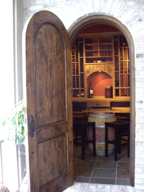 Medium sized traditional wine cellar in New Orleans with storage racks.