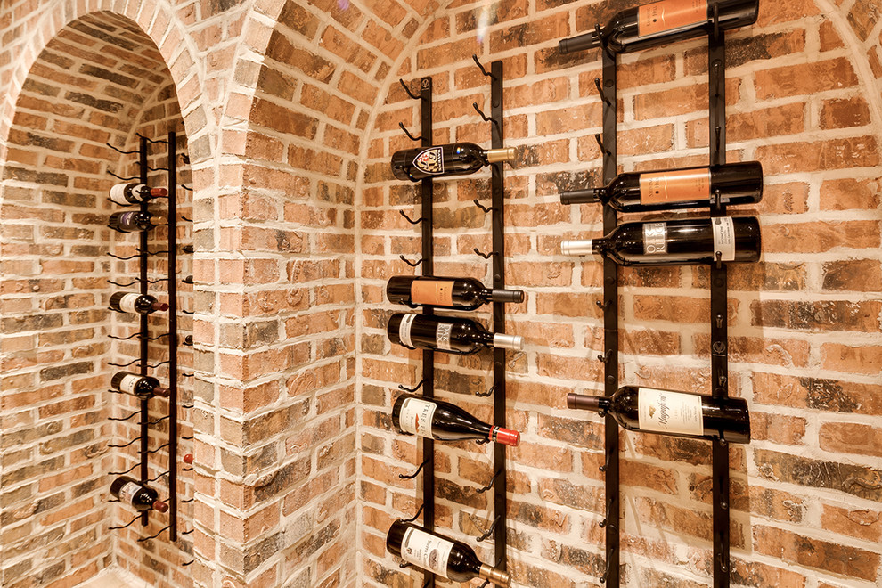 Inspiration for a mid-sized rustic light wood floor wine cellar remodel in Baltimore with display racks
