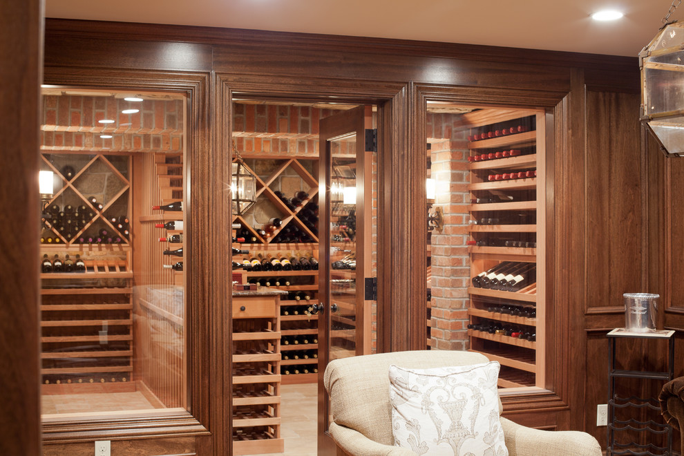 Inspiration for a large timeless medium tone wood floor wine cellar remodel in New York with display racks