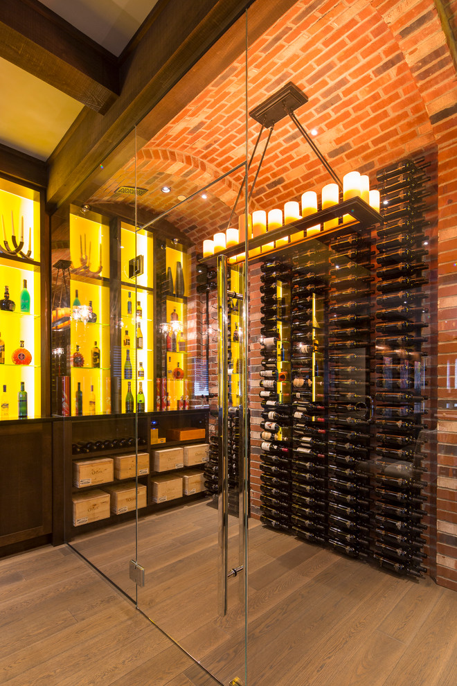 Inspiration for a contemporary wine cellar in Vancouver with dark hardwood flooring, storage racks and yellow floors.