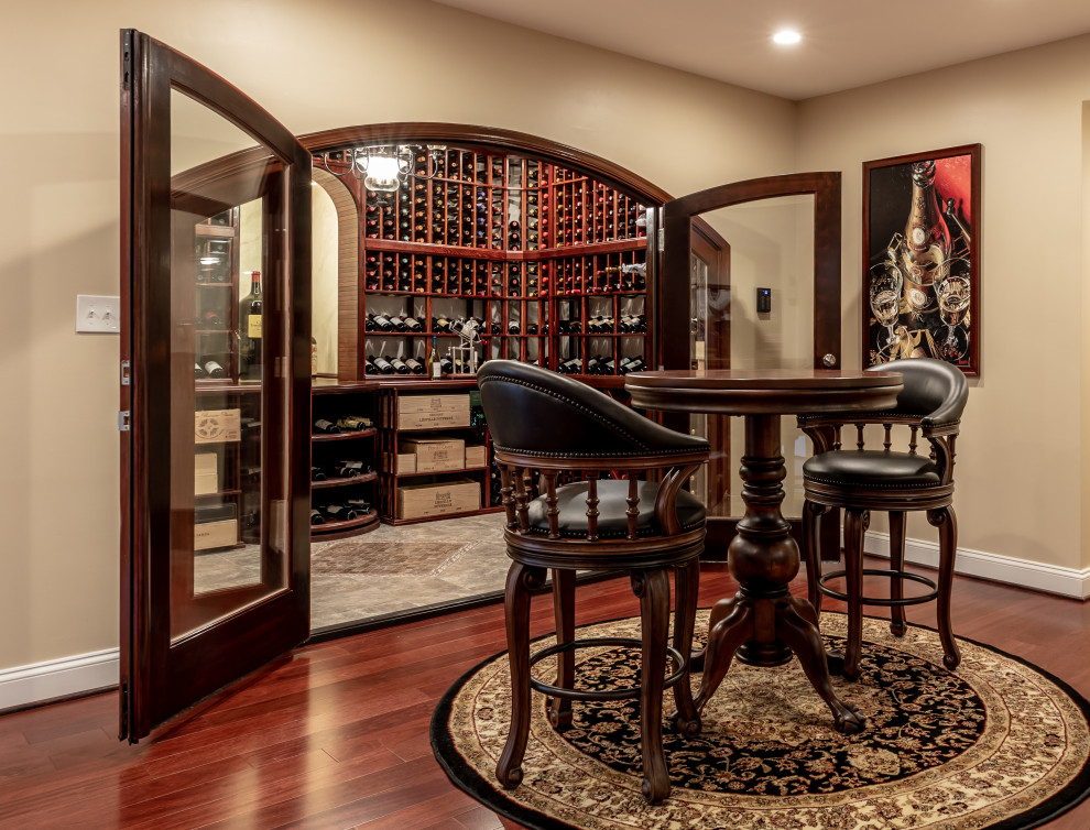 Design ideas for a large classic wine cellar in DC Metro with storage racks.