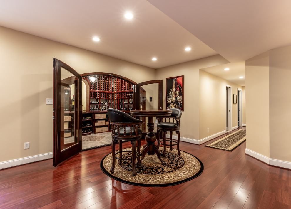Example of a large transitional wine cellar design in DC Metro with storage racks