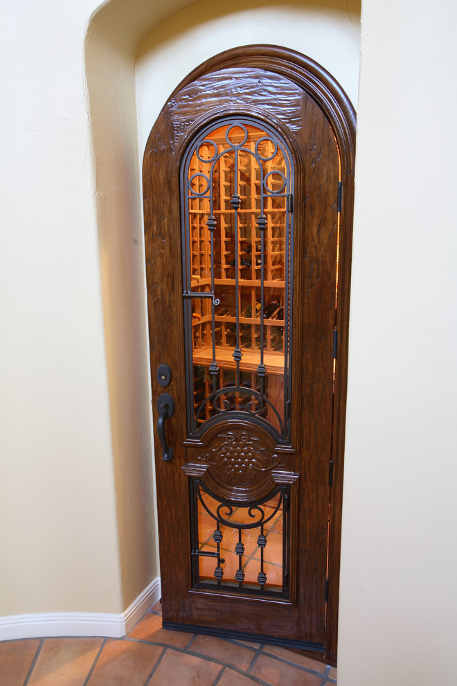 Arched Wine Cellar Door with Glass Insert and Wrought Iron Bars
