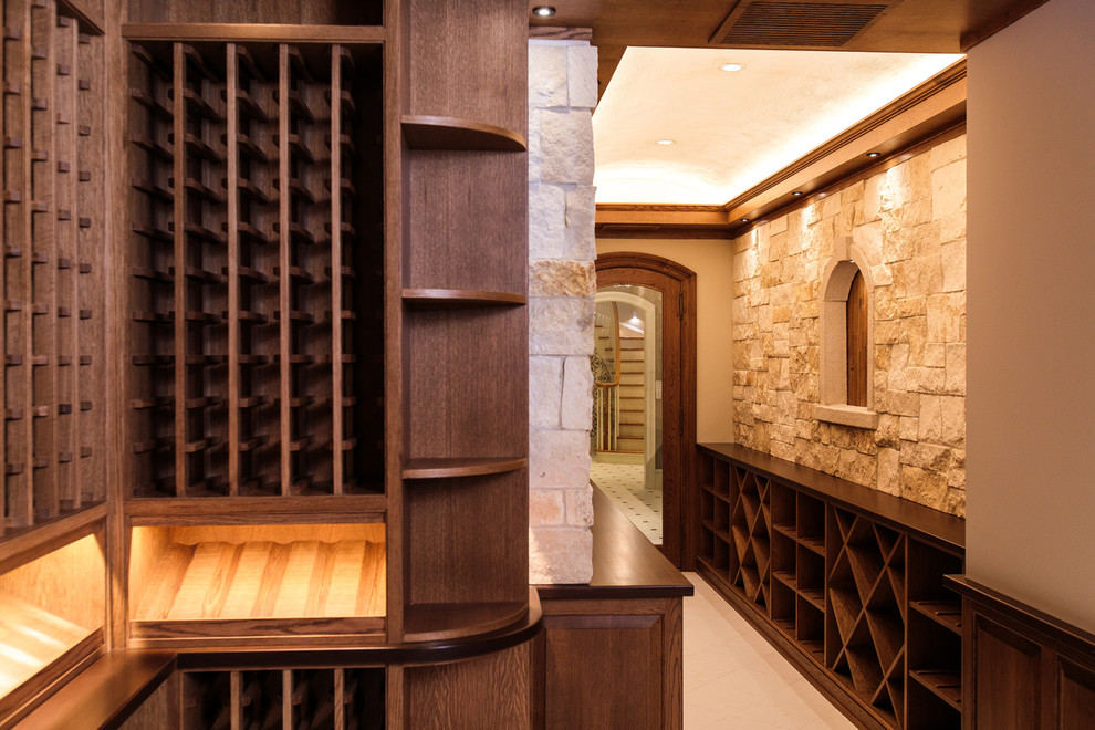 Wine cellar - large traditional beige floor wine cellar idea in Boston with diamond bins