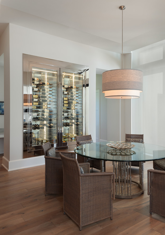Example of a mid-sized transitional wine cellar design in Miami with display racks
