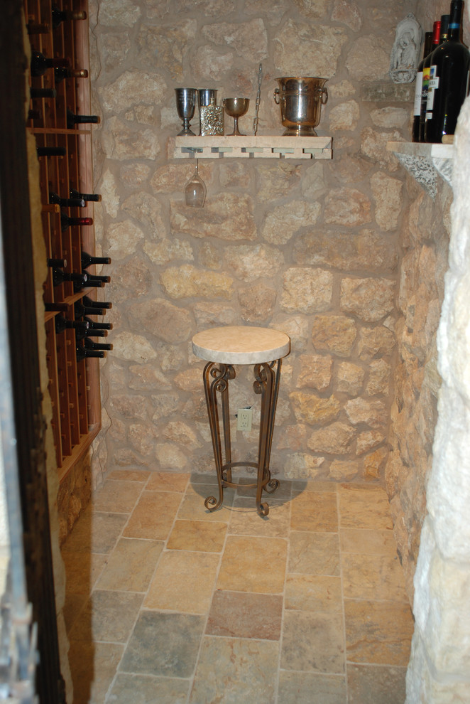 Inspiration for a rustic wine cellar in Orange County.