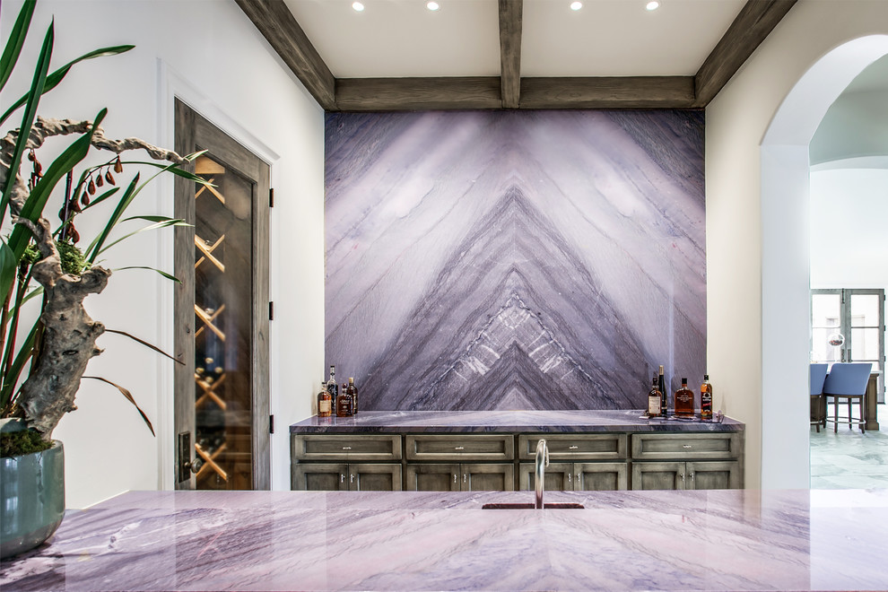Inspiration for a large transitional marble floor wine cellar remodel in Dallas with diamond bins