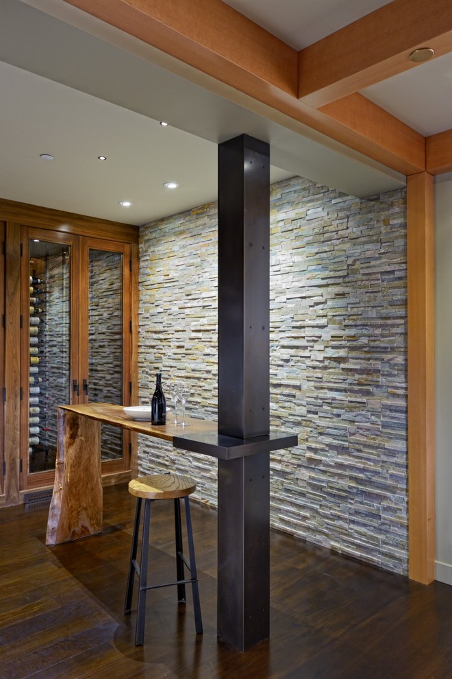Example of a mountain style wine cellar design in Seattle