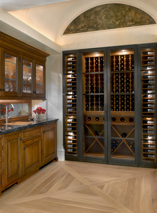 Wine cellar - traditional light wood floor wine cellar idea in Chicago with storage racks