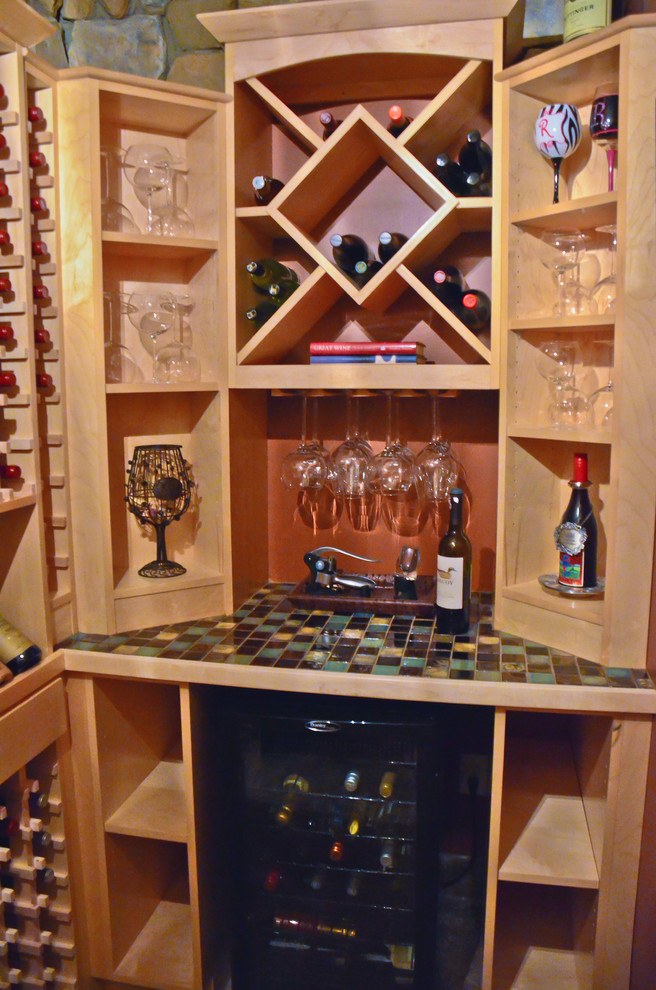 Inspiration for a small classic wine cellar in Kansas City with storage racks.