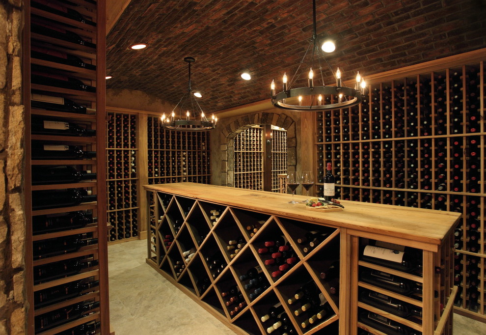 Wine cellar - huge rustic marble floor and beige floor wine cellar idea in Atlanta with storage racks