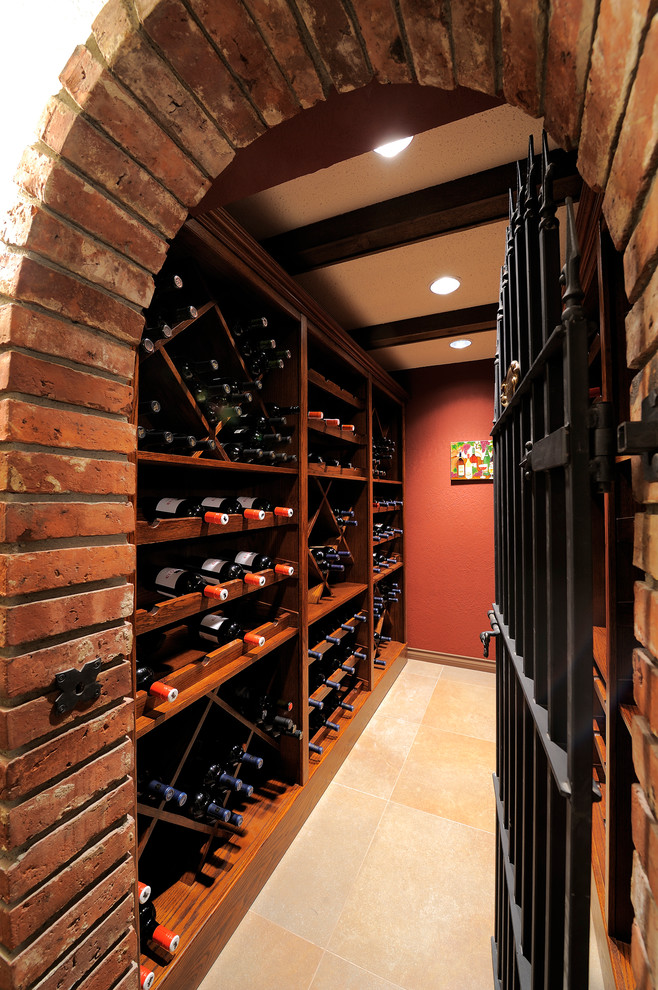 Example of a small trendy porcelain tile wine cellar design in Vancouver with storage racks